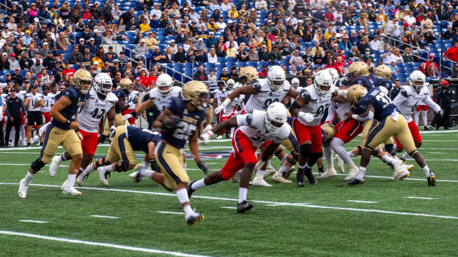 Cincinnati carries the ball against Navy in 2021.