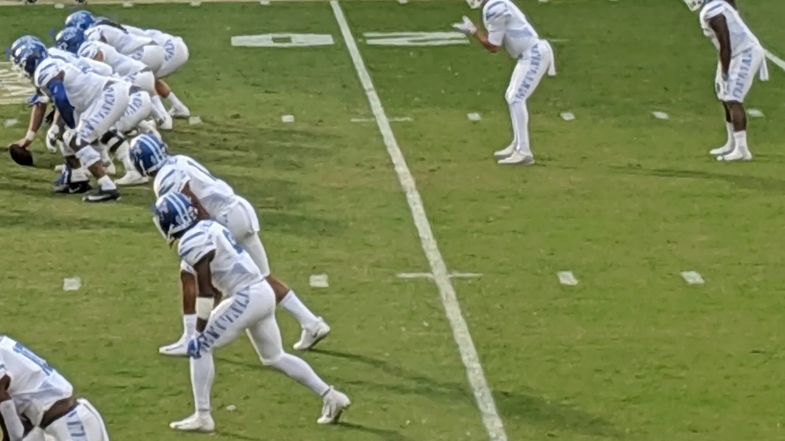 Memphis football players in white Tigers uniforms line up during the 2018 American Athletic Conference Championship.