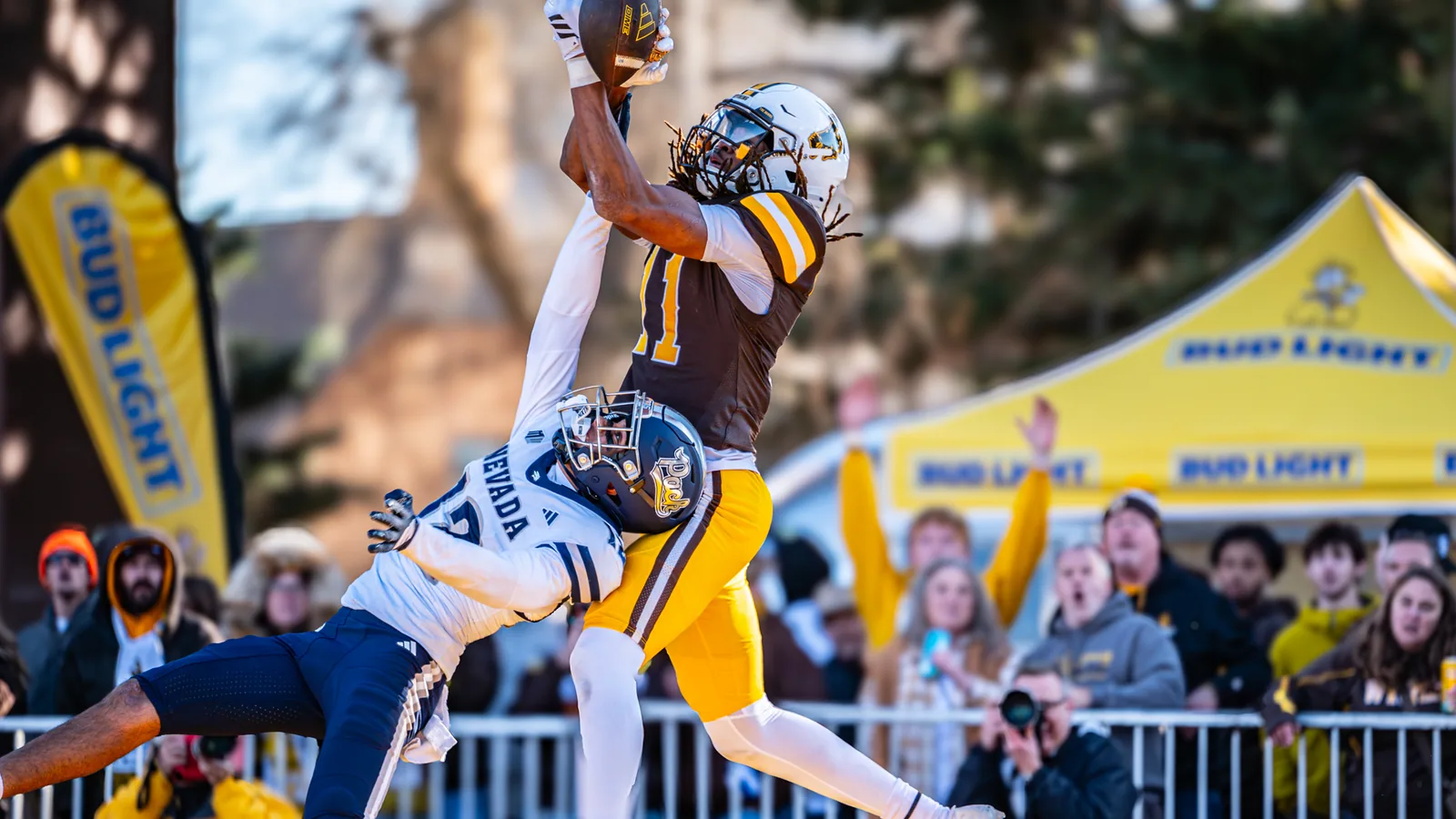 A Nevada receiver makes a catch against Wyoming in 2025.