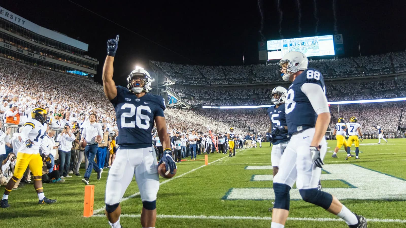Penn State players celebrate a touchdown against Michigan at Beaver Stadium in 2017.