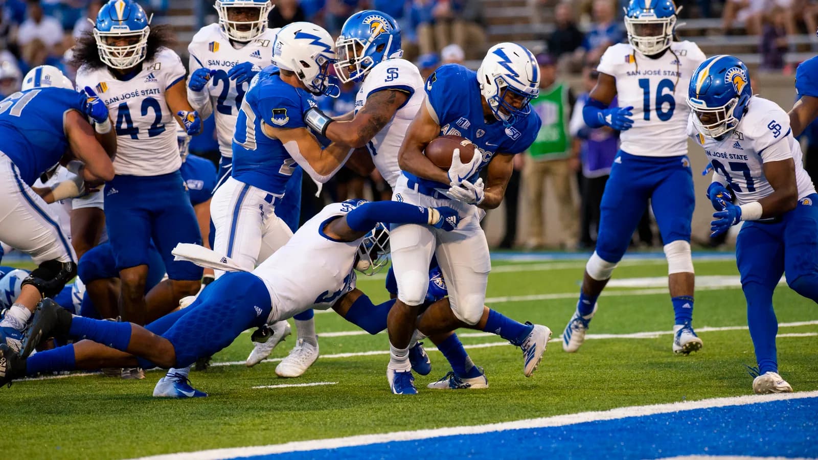 San Jose State defenders tackle an Air Force ball carrier in 2019.