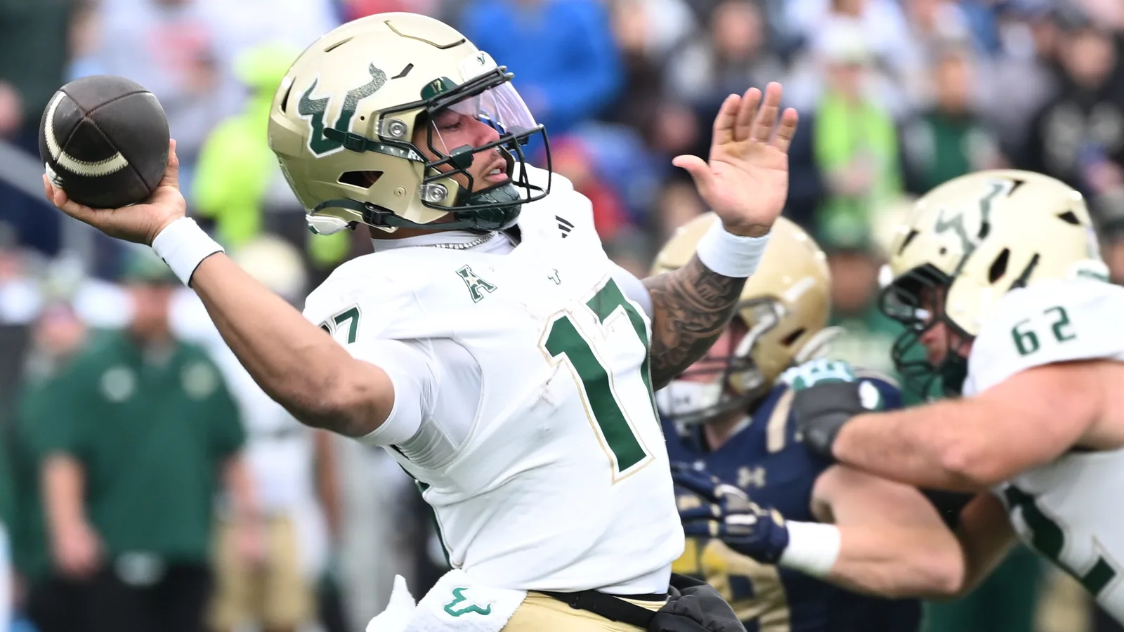 South Florida quarterback Byrum Brown throws against Navy.