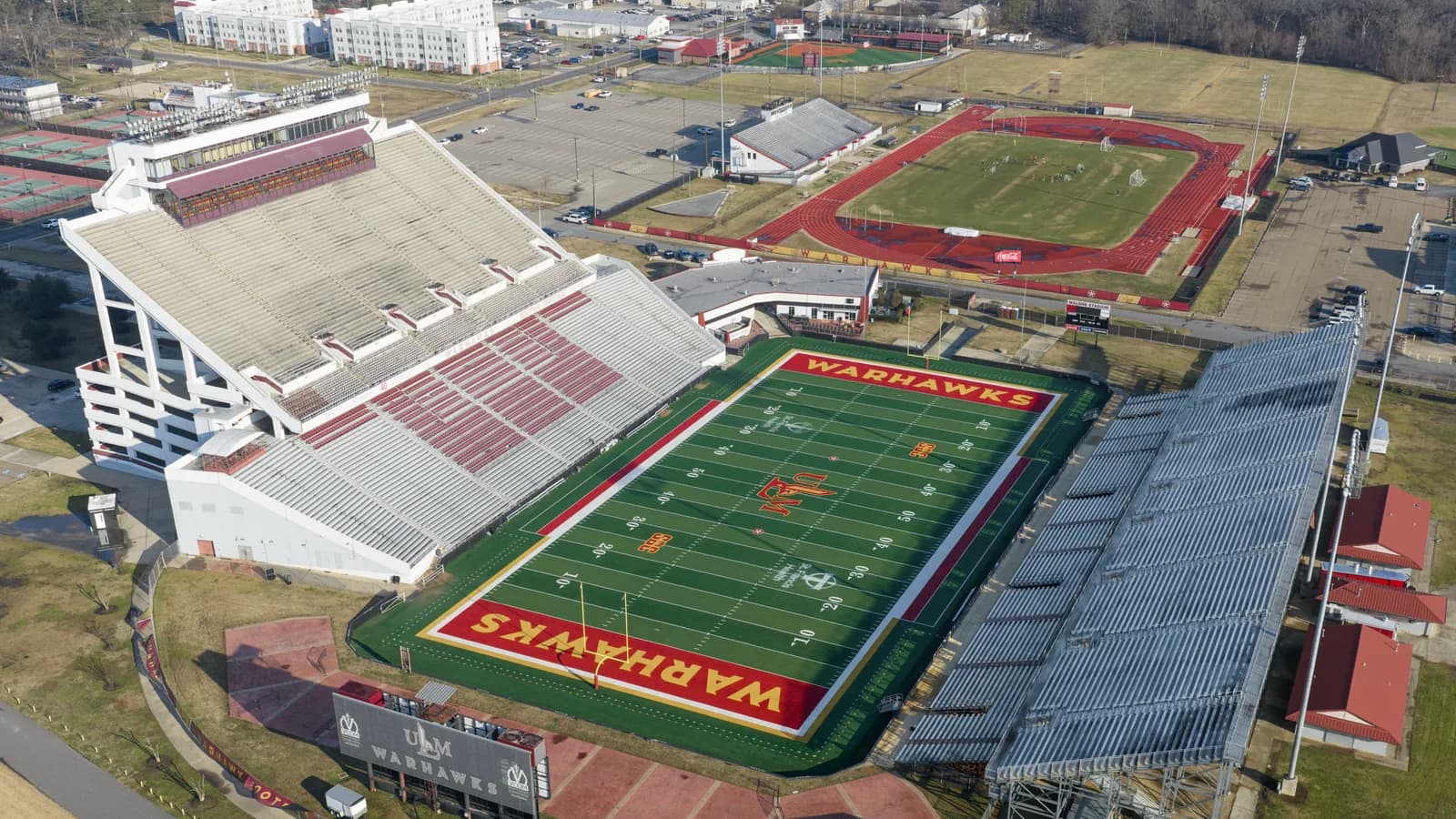 An aerial view of Malone Stadium with Warhawks end zones and the ULM mark at midfield.