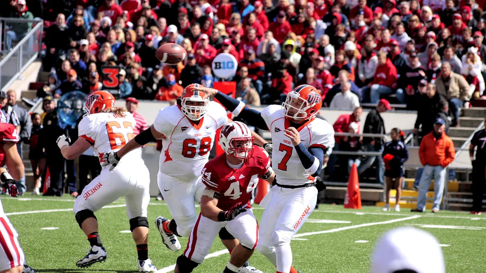 A UTEP quarterback throws under pressure.