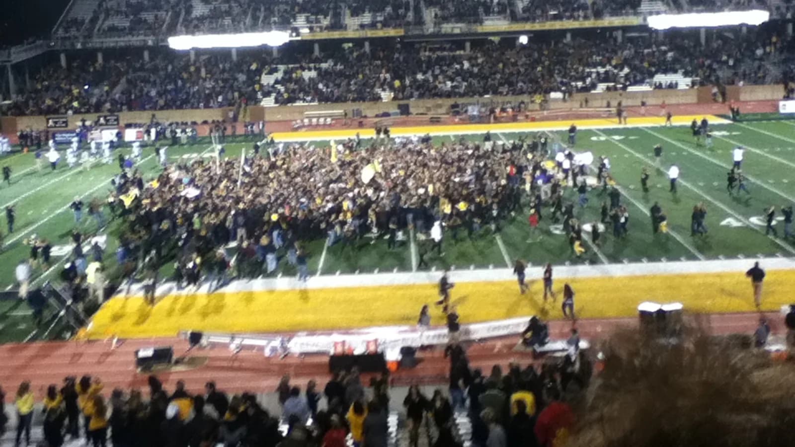 App State fans fill the field at Kidd Brewer Stadium after a win over Furman.
