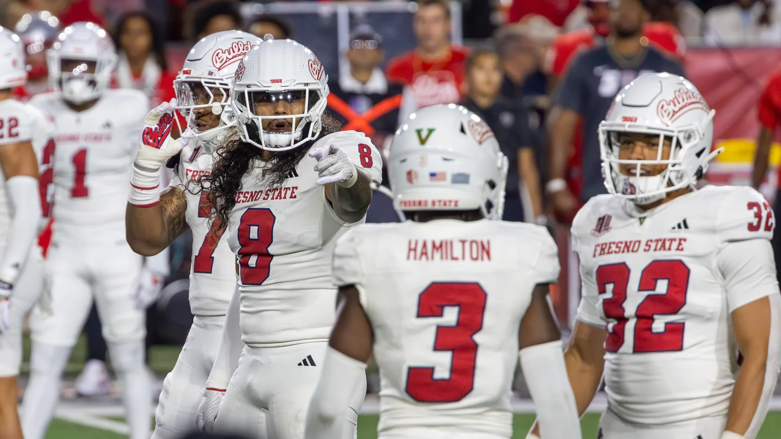 Fresno State players prepare to face New Mexico in 2024.